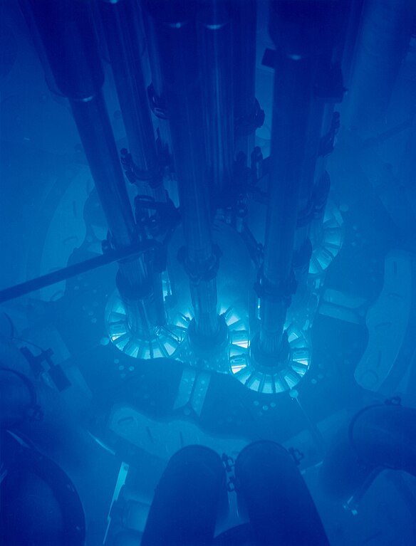 The Advanced Test Reactor at Idaho National Laboratory uses plate type fuel in a clover leaf arrangement. The blue glow around the core is known as Cherenkov radiation. Courtesy of Idaho National Laboratory.