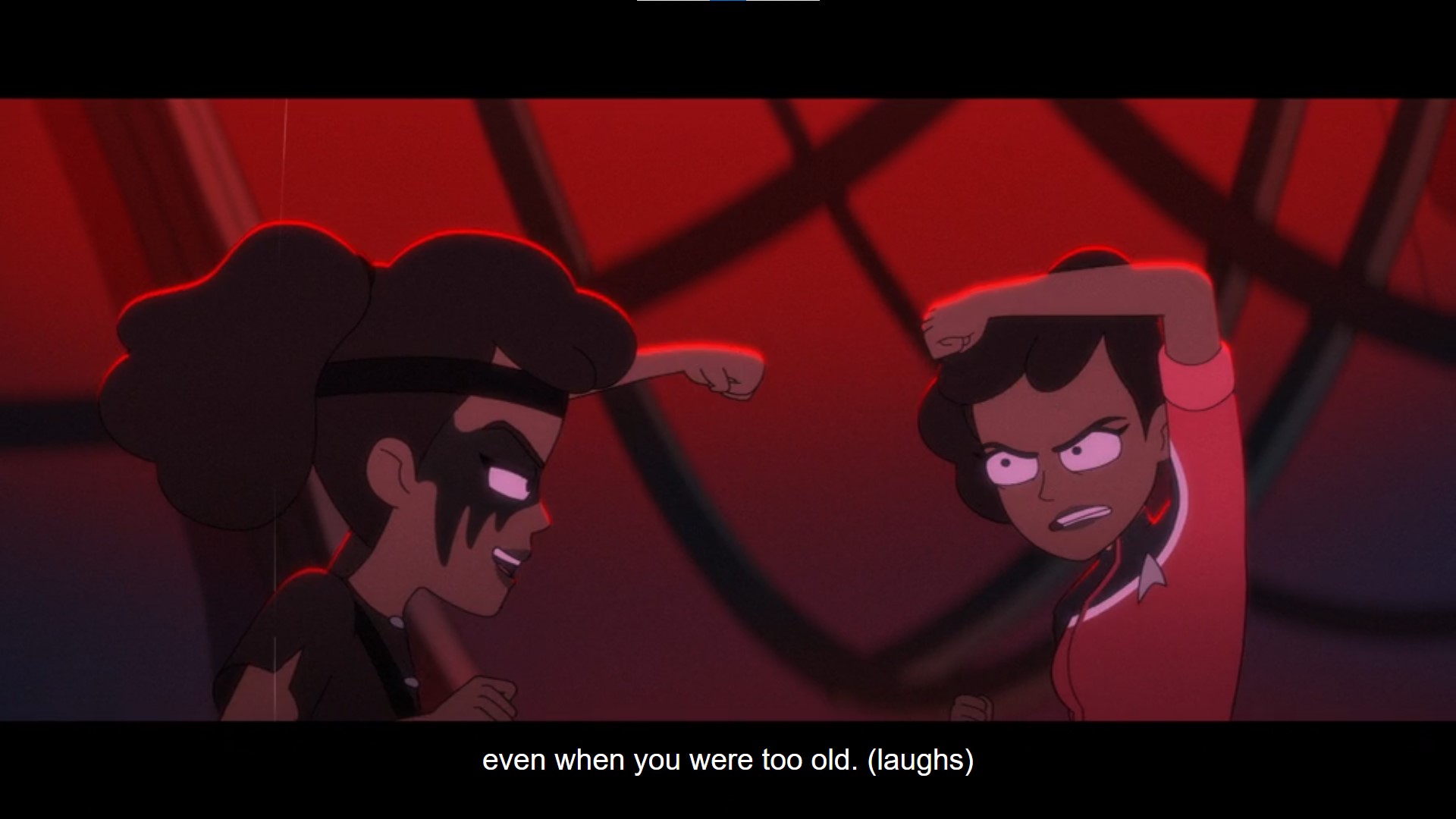 Two identical Black women face off in martial-arts poses in the red-lit ruins of a spaceship. The one on the left wears black clothes, a headband, and black facepaint resembling bird wings. The one on the right wears a standard Starfleet ensign's uniform in red.