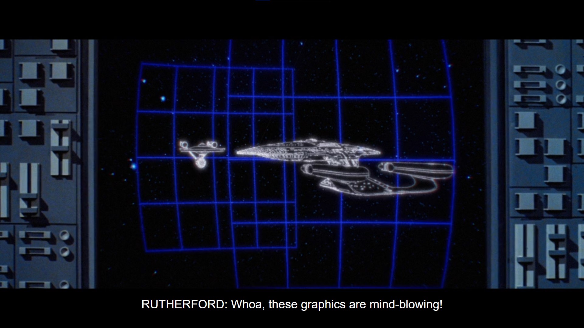 A tight shot of a computer console. The screen shows wireframe schematics of a Constitution-class starship facing a Galaxy-class starship.